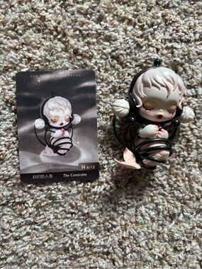 POP MART x SKULLPANDA The Constraint Figurine - Pale Pink & Black